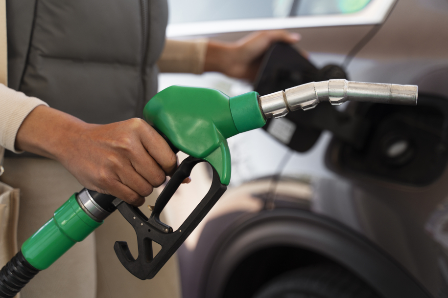 view-woman-with-car-gas-station