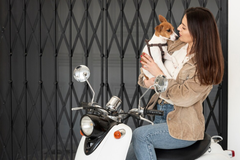 motorcycle driver and a dog tied with a leash