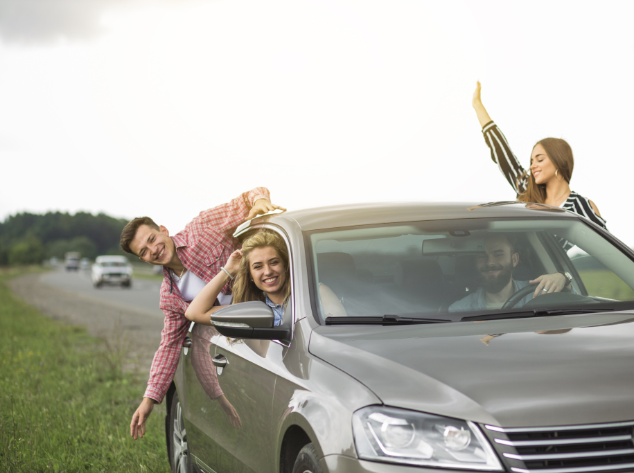 group-friends-travelling-car-hanging-out-through-open-window