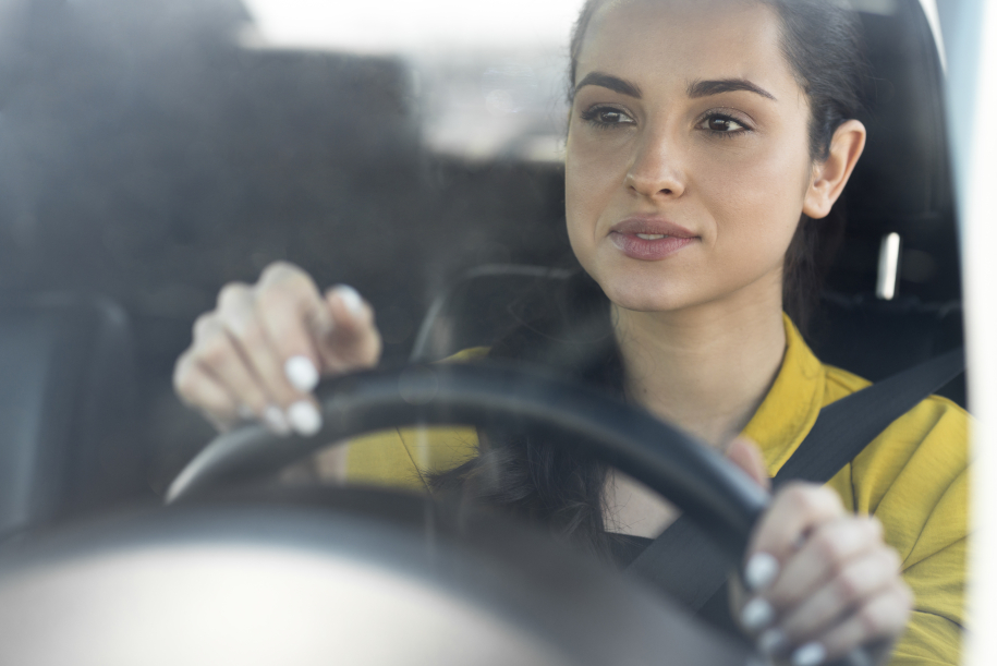 woman-yellow-shirt-drives