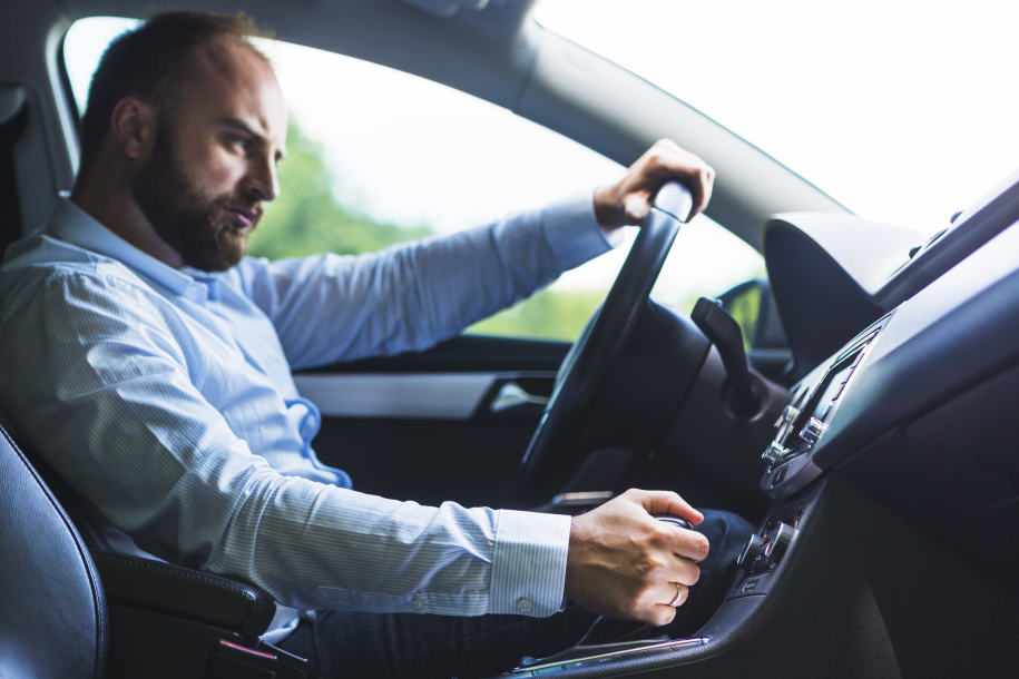 man driving slow a car