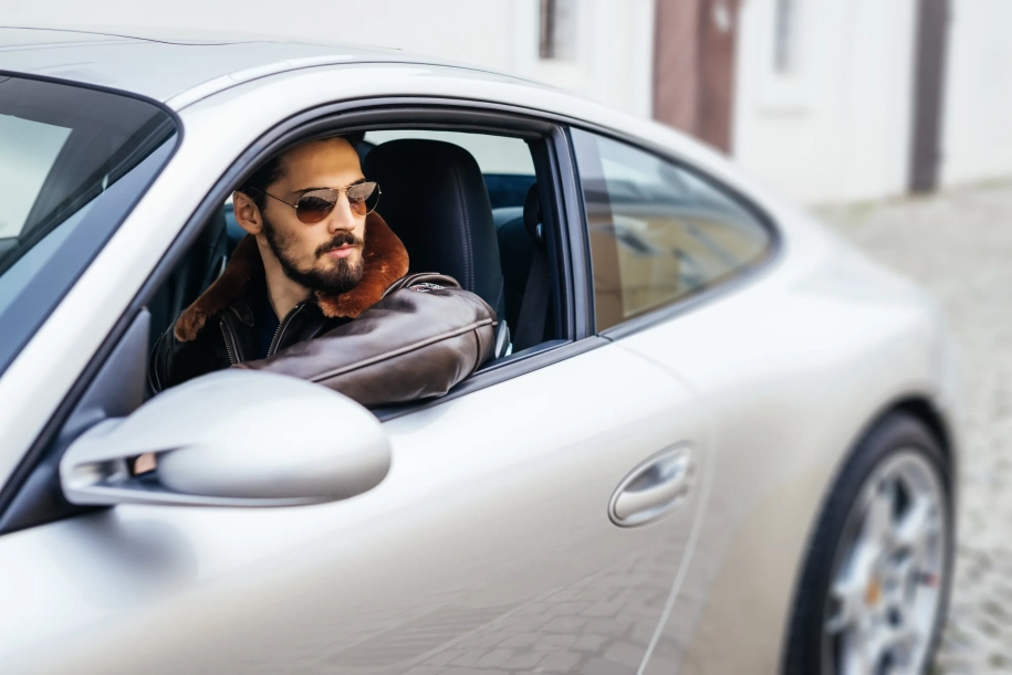 man waiting inside a car