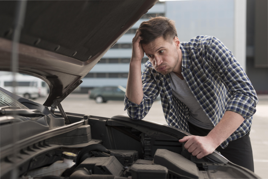 young-man-trying-repair-car