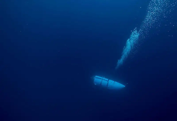 An OceanGate tourist submersible descending from the surface