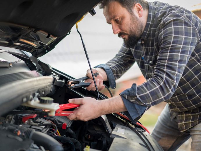 man_checking_car_battery