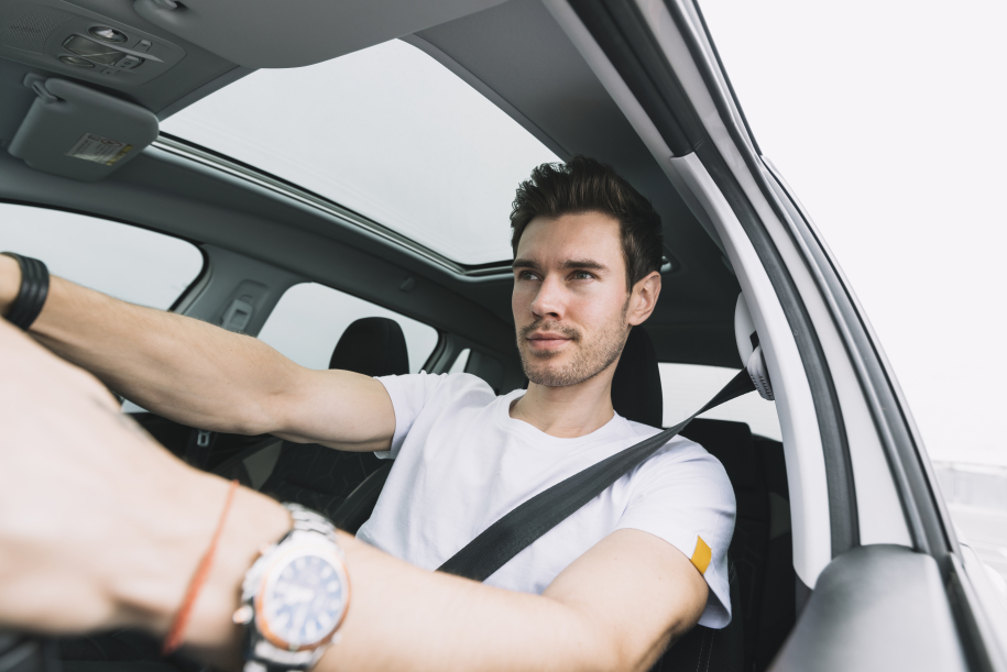 close-up-young-man-driving-car