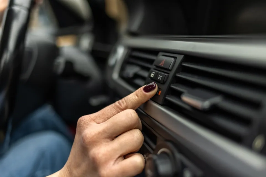 woman adjusting interior temperature