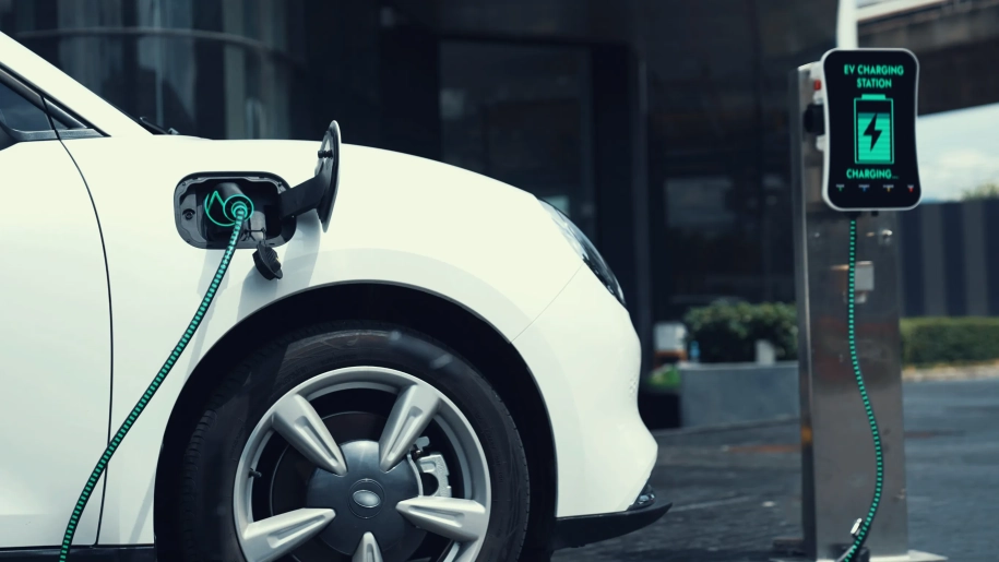 Electric car connected to charging station