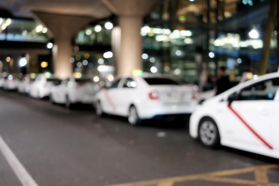 White taxi airport parking